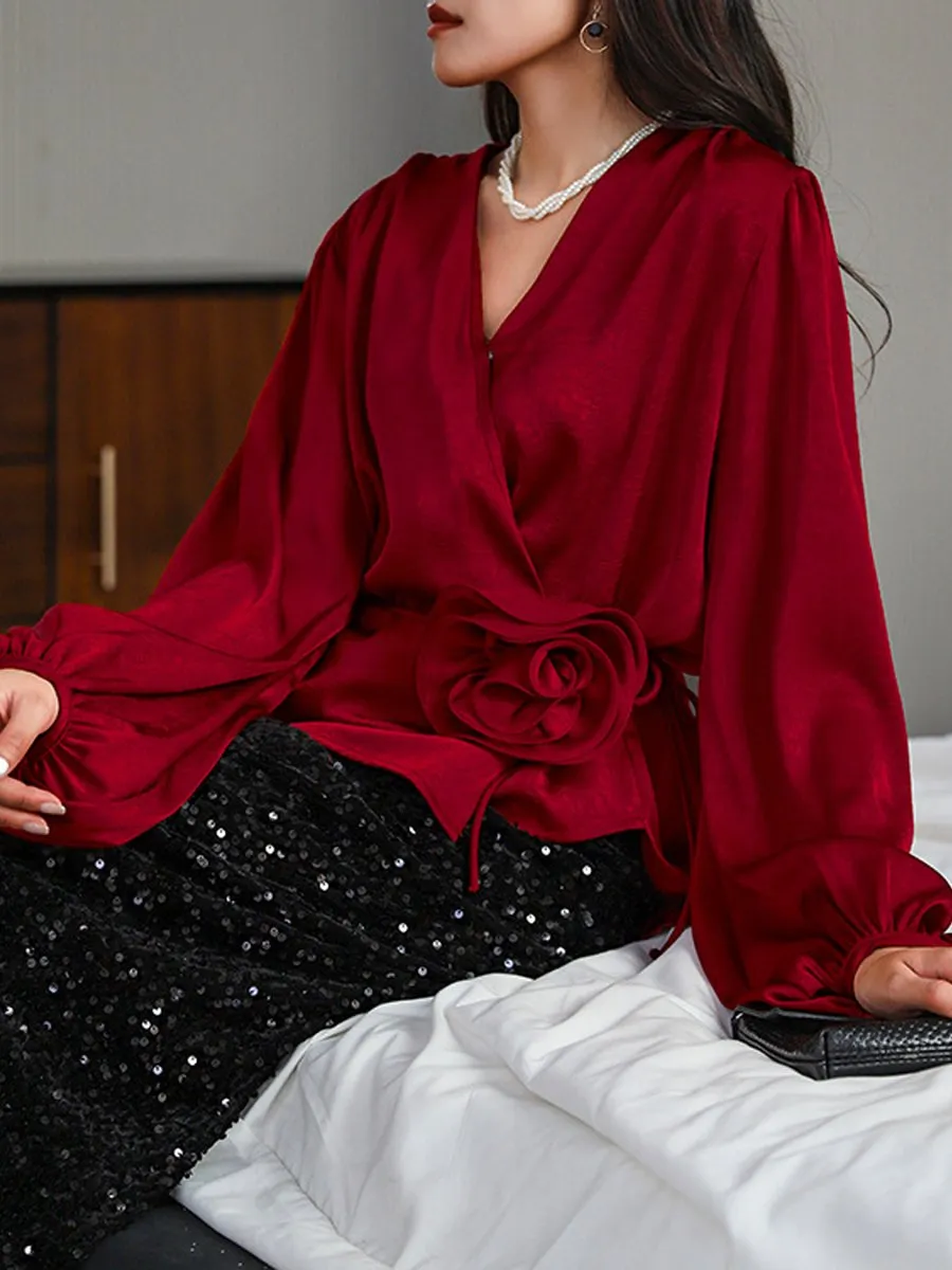 Stylish Wrap Blouse with Floral Accent